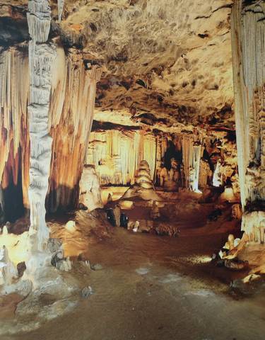 Beautiful cave interior with dramatic stalactites and rock formations.
