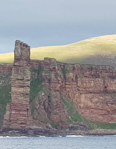Sea cliffs with a distinctive rock stack.