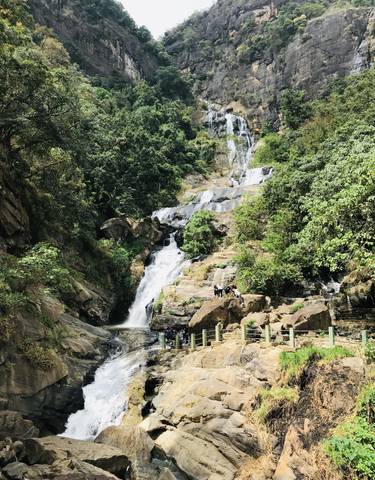 Waterfall with people at the base.