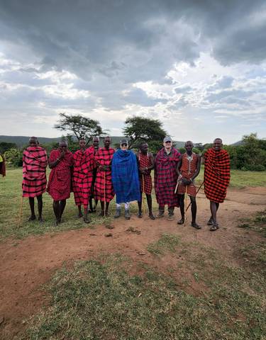 Group photo of Maasai people in traditional attire.