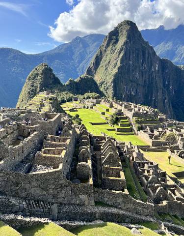 The iconic stone ruins of Machu Picchu against a backdrop of mountains.