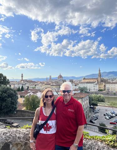 Couple with a panoramic view of Florence.