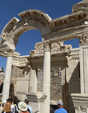 Ancient Roman ruins with detailed carvings and arches.