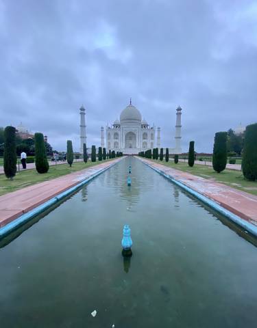 View of the Taj Mahal with reflecting pools in the foreground.