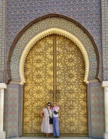 Ornate golden door with intricate designs in Morocco.