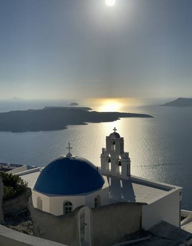 Sunset view over the sea with church domes.