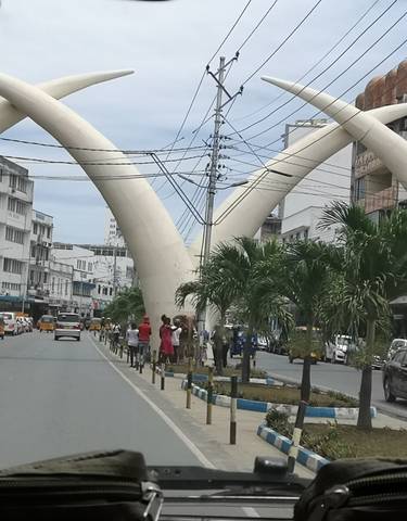 A street in Mombasa with large tusk-shaped arches.