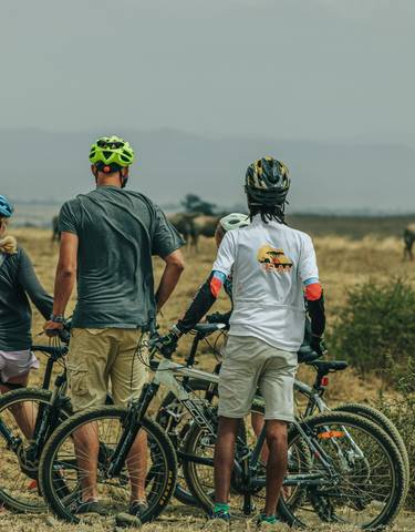 Cyclists observing wildlife on the plain