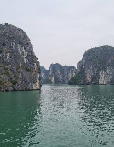 Scenic view of limestone islands in Halong Bay.