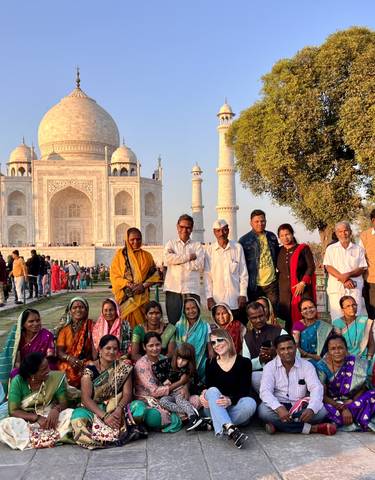 Large group of people in front of the Taj Mahal.