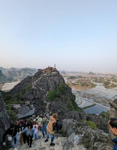 Dramatic mountain landscape with a distant city view.