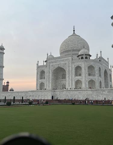 Iconic white mausoleum with dome and minarets.