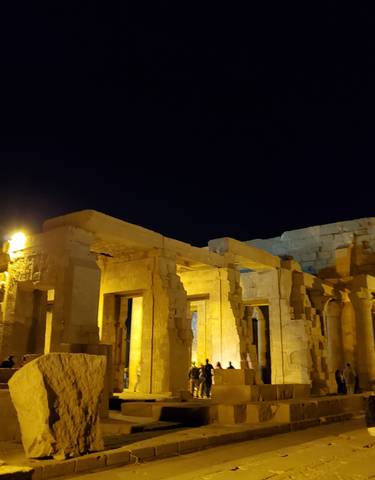 Illuminated ancient ruins during nighttime.