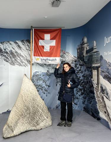 Person with a Swiss flag on Jungfraujoch.