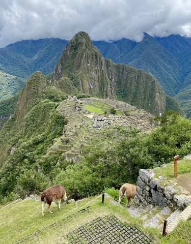 Elevated view of Machu Picchu surrounded by mountains.