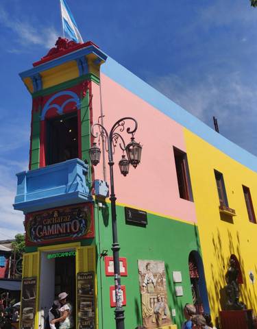 Colorful building with vivid paint and signs.