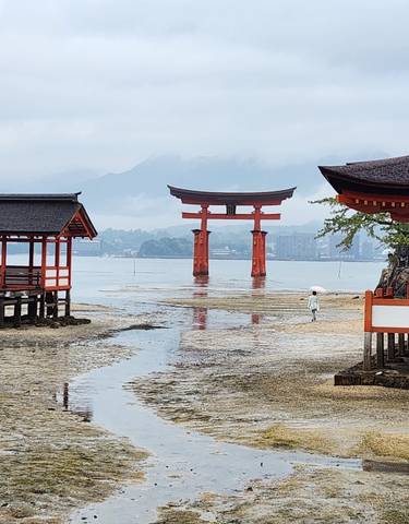 Scenic view of Itsukushima Shrine with iconic torii gate in Hiroshima.