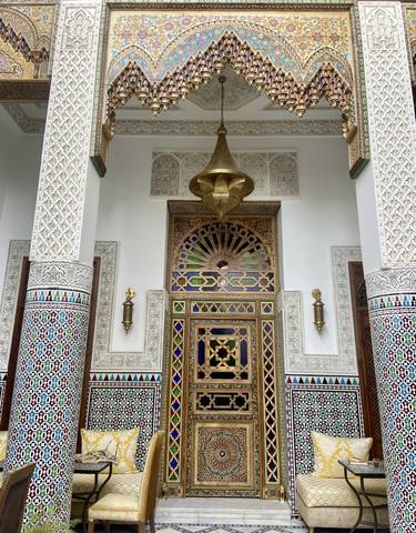 Intricately designed Moroccan doorway with colorful tiles.