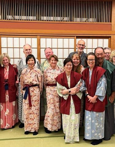 Group wearing traditional Japanese attire indoors.