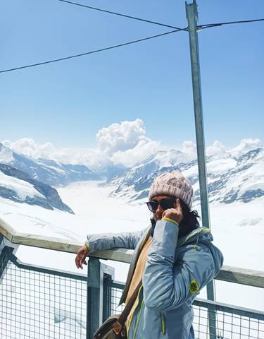 Person with a phone in snowy mountains