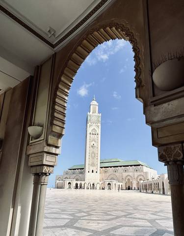 Ornate mosque architecture with a clear sky.
