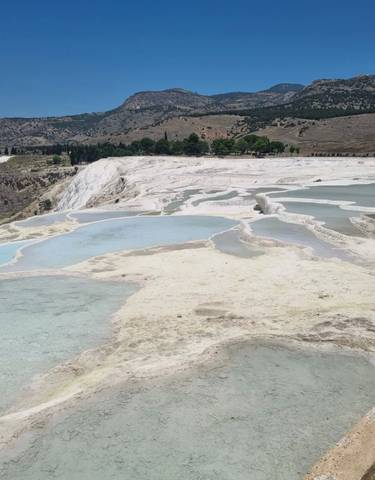 Travertine terraces with water pools in Pamukkale.