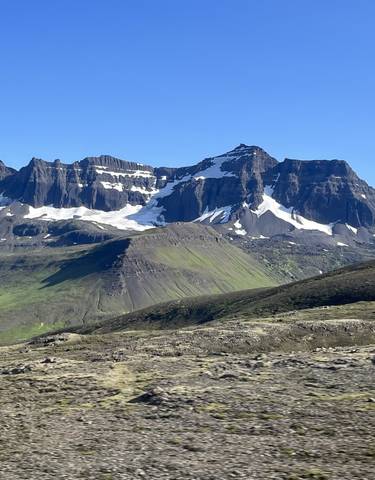 Snow-capped mountains in a rugged landscape.