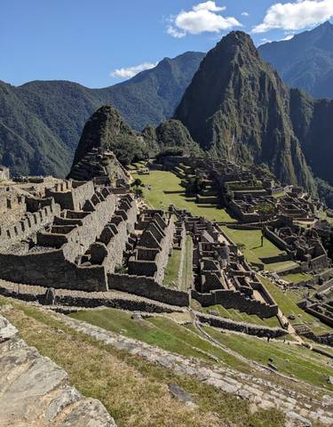 Ancient Incan ruins in a mountainous landscape.