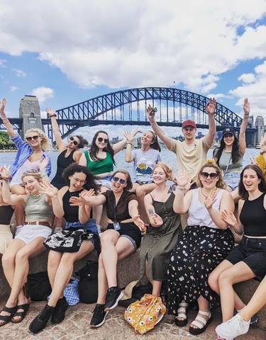 Group gathering with Sydney Harbour Bridge in the background.