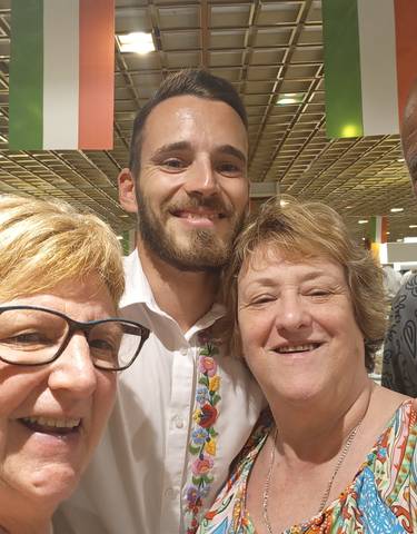 Group selfie with people smiling.