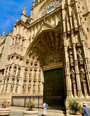 Gothic cathedral entrance with statues.