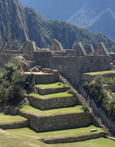 Ancient stone ruins on a mountain with clear skies.