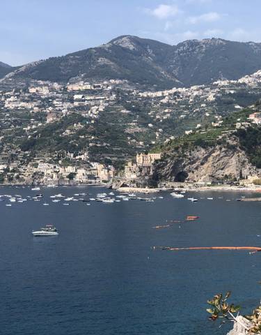 Expansive view of Amalfi Coast with mountains and sea.