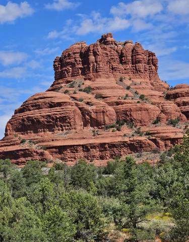 Bell Rock in Sedona under a blue sky.
