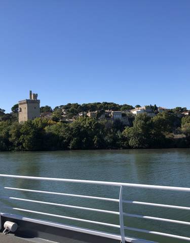 View of a river with a castle in the background.