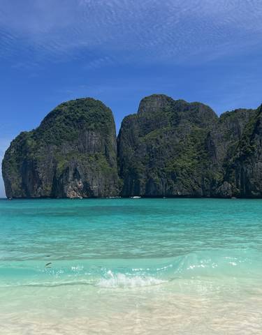 Scenic view of cliffs and turquoise sea.