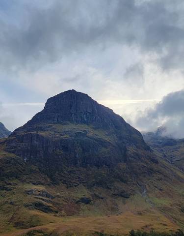 Mountains with a moody sky in the background.