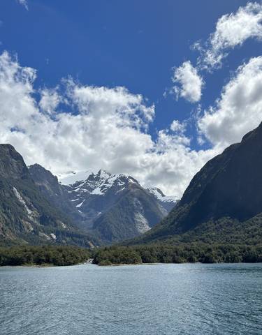 Stunning view of a fjord with snow-capped mountains.