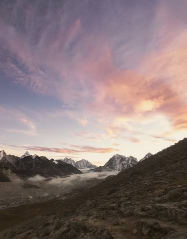 A stunning view of mountains at sunrise with vibrant sky.