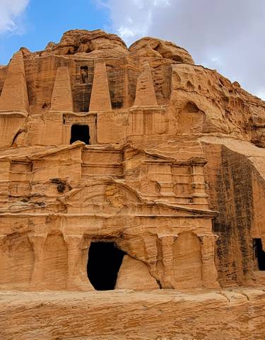 Ancient rock-cut architecture with intricate designs.