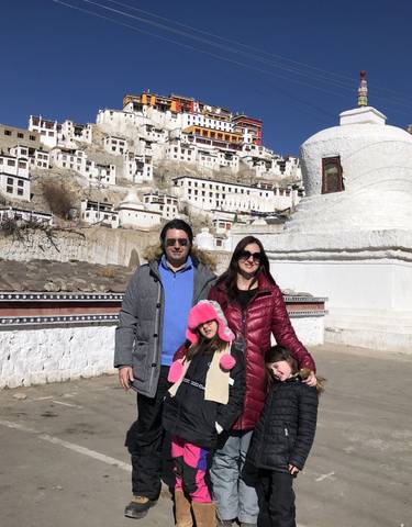 Family posing in front of a monastery at Leh.