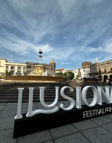 Fountain and buildings in a city square.