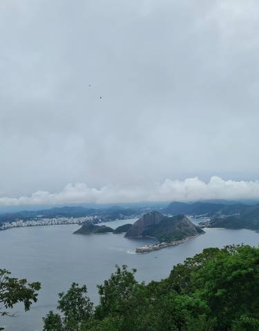 Aerial view of a bay and cityscape with iconic mountain