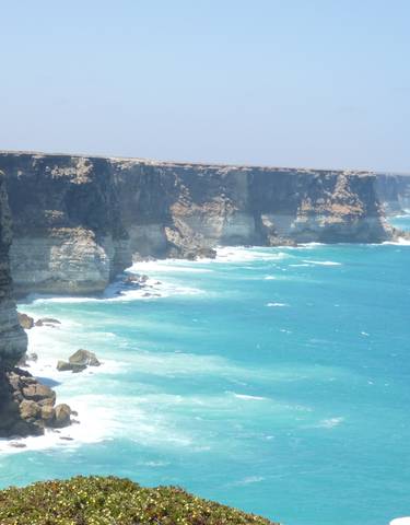 Stunning coastal cliffs with turquoise sea.