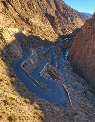 Snaking road through rugged mountain terrain.