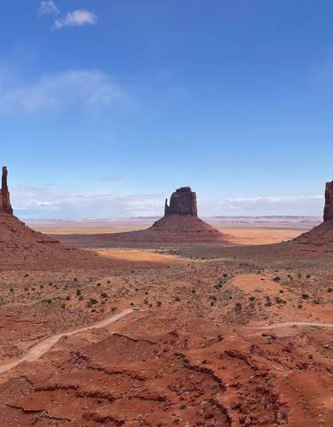 Wide view of Monument Valley with iconic buttes.