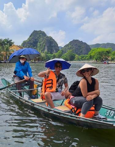 Group enjoying a boat ride in scenic surroundings.