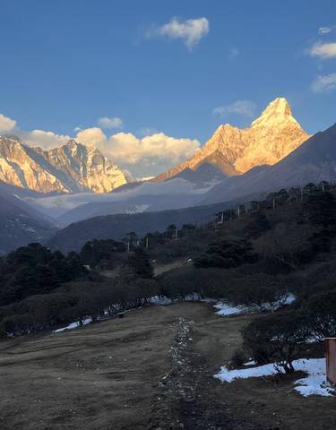 Scenic view of mountains with colorful light at dusk.