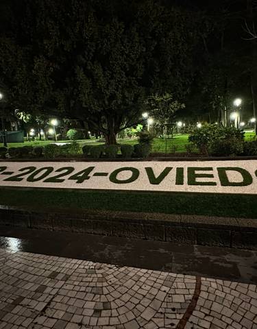 Park with a sign featuring the date and Oviedo name.