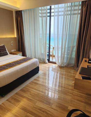 Hotel room with a view of the ocean.